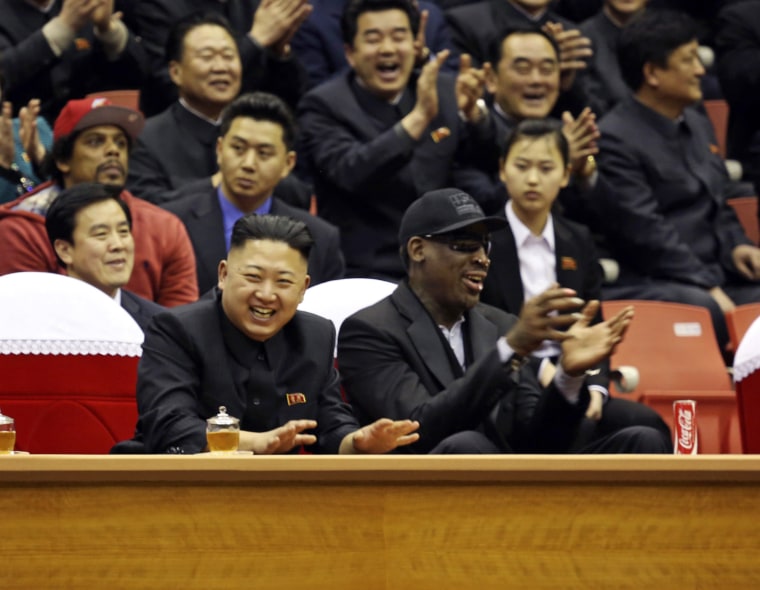 Image: North Korean leader Kim Jong-un and former NBA star Dennis Rodman watch an exhibition basketball game in Pyongyang